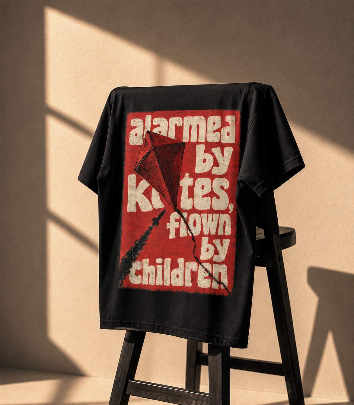 Kites of Gaza oversized tee — kite graphic with the line about children flying kites